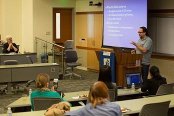 Professor Kaimipono Wenger addressing the presentation attendees